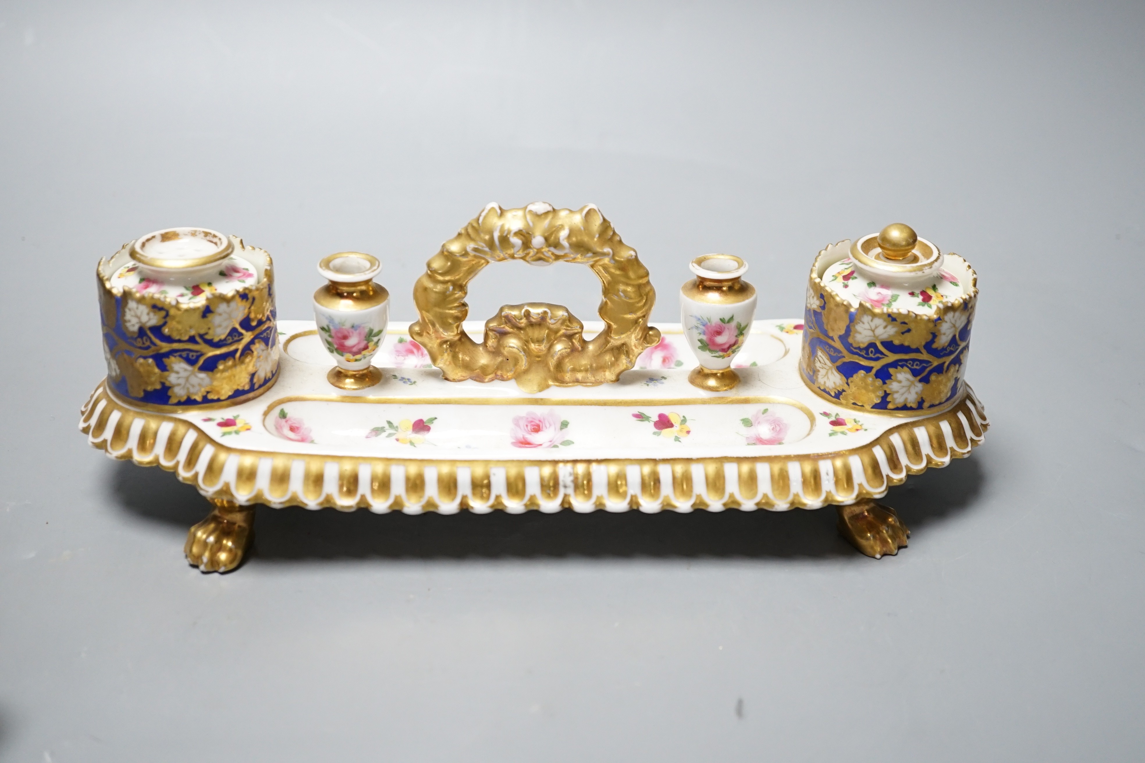 A 19th century Chamberlain Worcester inkstand painted with roses and heatsease, script mark, and a 19th century English porcelain leaf shaped inkwell with strawberry shaped wells, encrusted with flowers picked out in gil